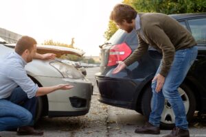 Two drivers that have collided not practicing safety tips