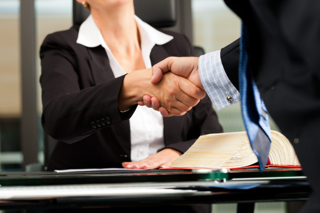 A person shaking hands with a future employer 